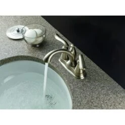 Delta Linden Centerset Bathroom Faucet With Diamond Seal Technology - Includes Plastic Pop-Up Drain And Lifetime Warranty -Bathroom Sales Store delta 2594 tp dst application shot 533