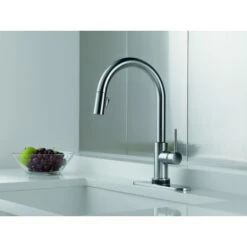 Delta Trinsic Pull-Down Kitchen Faucet With On/Off Touch Activation, Magnetic Docking Spray Head, And Soap/Lotion Dispenser - Includes Lifetime Warranty (5 Year On Electronic Parts) -Bathroom Sales Store delta 9159t dst application shot 433