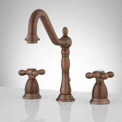 Victorian Widespread Bathroom Faucet With Metal Cross Handles And Pop-Up Drain Assembly