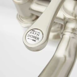 Glenwood Deck Mounted Roman Tub Filler With Variable Couplers- Includes Telephone Style Hand Shower -Bathroom Sales Store signature hardware 906537 handle close up brushed nickel 154