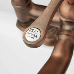 Glenwood Deck Mounted Roman Tub Filler With Variable Couplers- Includes Telephone Style Hand Shower -Bathroom Sales Store signature hardware 906537 handle close up oil rubbed bronze 498